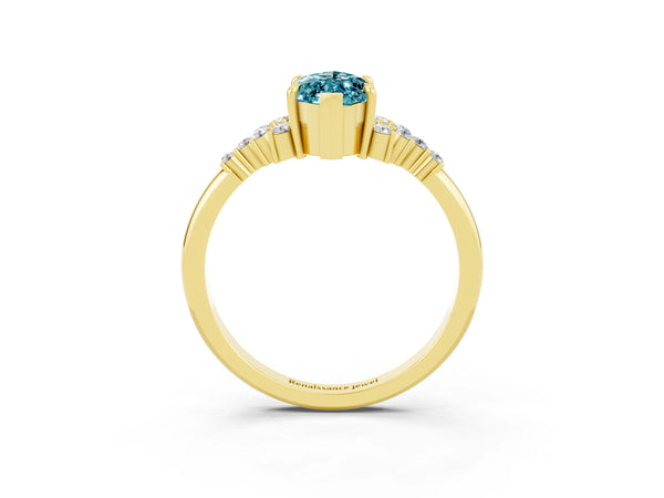 Yellow gold Marquise Cut Blue Topaz Ring with Side Stones and Four-Prong Setting