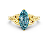 Yellow gold Marquise Cut Blue Topaz Solitaire Engagement Ring with Celtic Knot Band and Four-Prong Setting