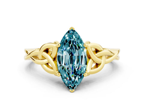 Yellow gold Marquise Cut Blue Topaz Solitaire Engagement Ring with Celtic Knot Band and Four-Prong Setting