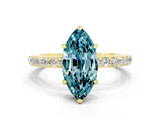 Yellow gold Marquise Cut Blue Topaz Solitaire Engagement Ring with Pavé Band and Four-Prong Setting