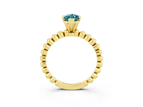 Yellow gold Marquise Cut Blue Topaz Solitaire Ring with Beaded Band and Prong Setting