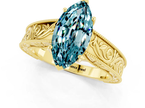 Yellow gold Marquise Cut Blue Topaz Solitaire Ring with Engraved Band and Four-Prong Setting_1