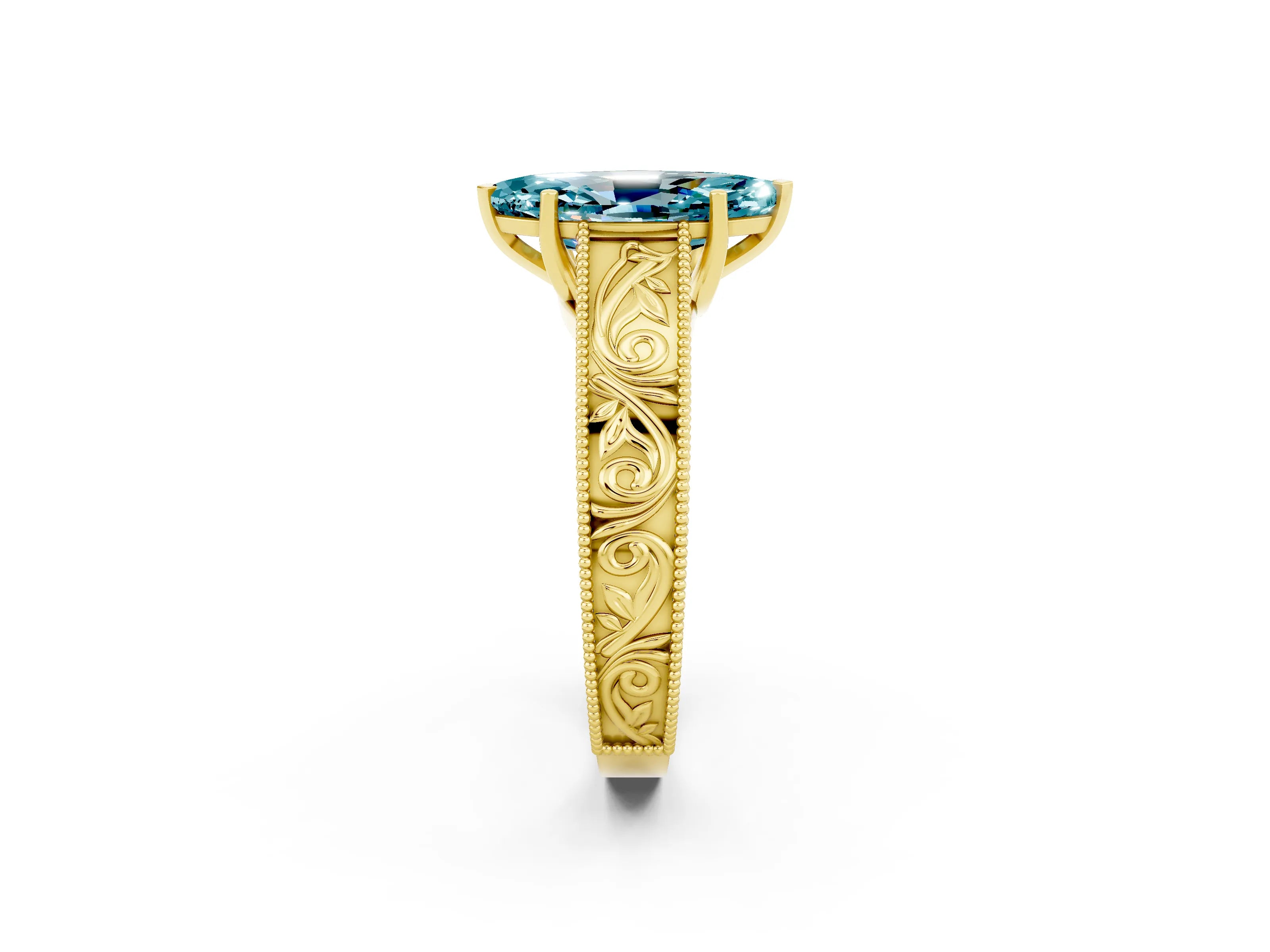 Yellow gold Marquise Cut Blue Topaz Solitaire Ring with Engraved Band and Four-Prong Setting_2