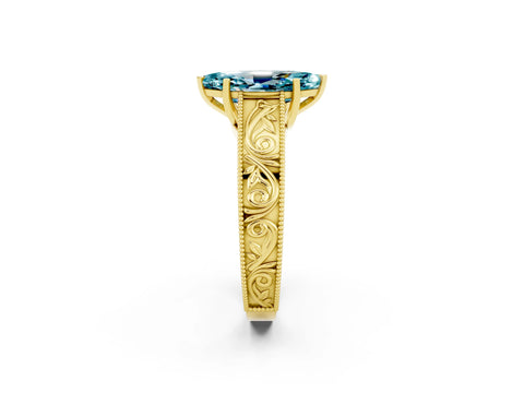 Yellow gold Marquise Cut Blue Topaz Solitaire Ring with Engraved Band and Four-Prong Setting_2