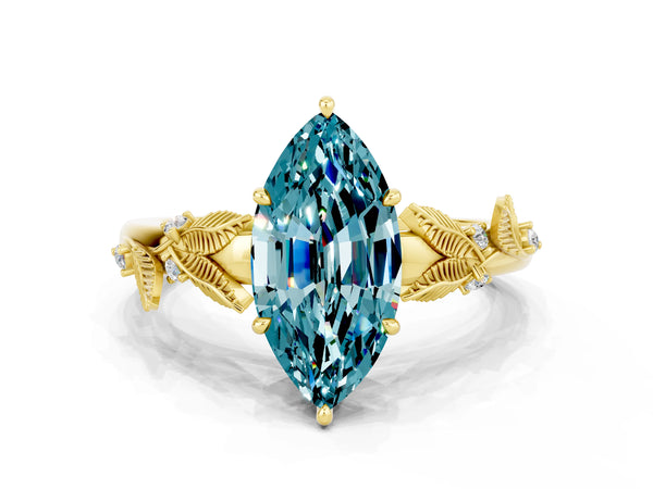 Yellow gold Marquise Cut Blue Topaz Solitaire Ring with Leaf Motif Band and Four-Prong Setting