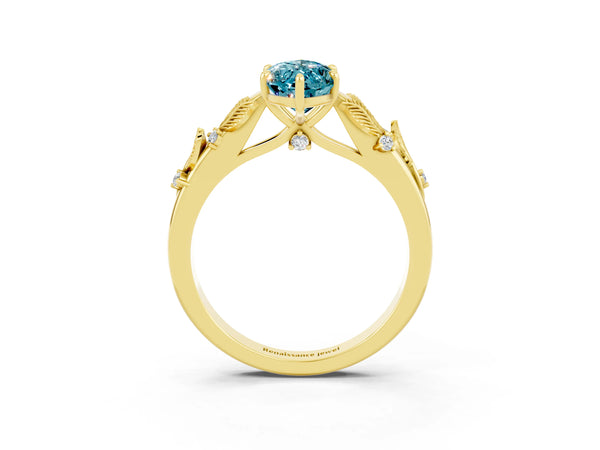 Yellow gold Marquise Cut Blue Topaz Solitaire Ring with Leaf Motif Band and Four-Prong Setting