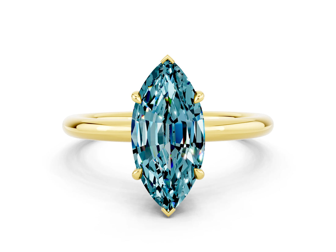 Yellow gold Marquise Cut Blue Topaz Solitaire Ring with Thin Band and Four-Prong Setting