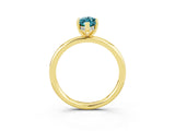 Yellow gold Marquise Cut Blue Topaz Solitaire Ring with Thin Band and Four-Prong Setting_3