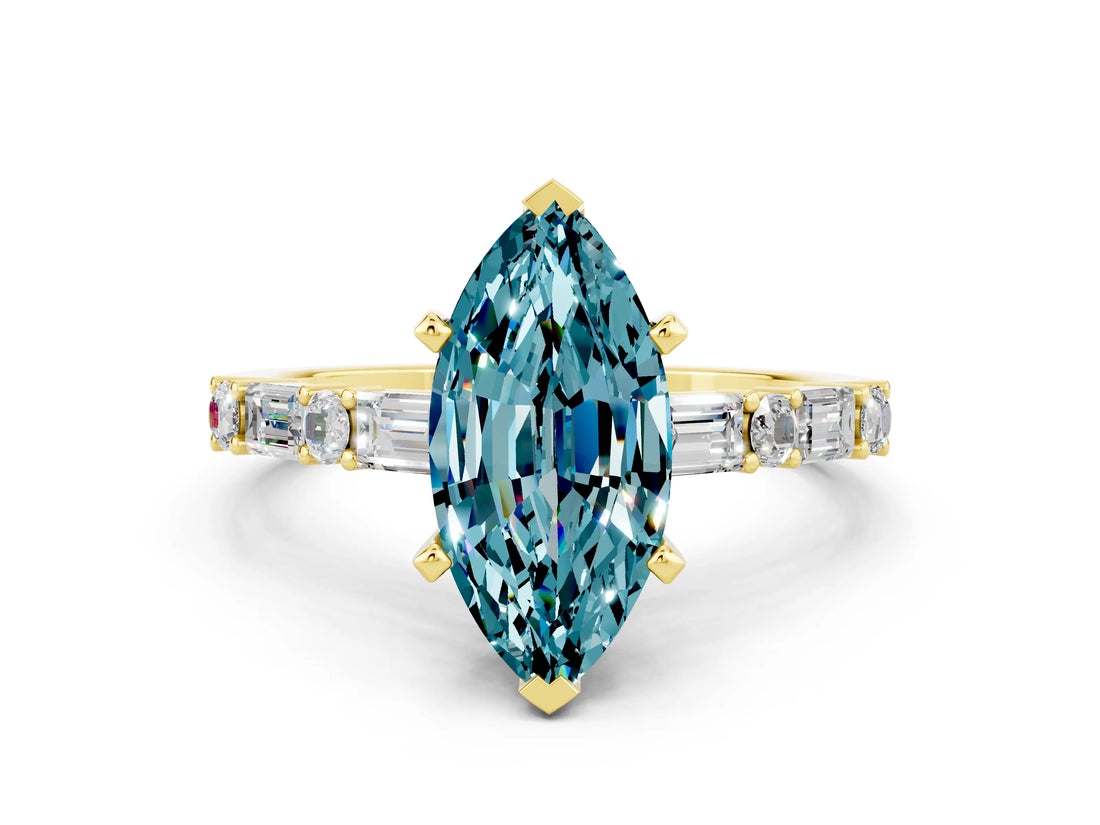 Yellow gold Marquise Cut Blue Topaz Solitaire with Side Baguettes and Channel Set Band