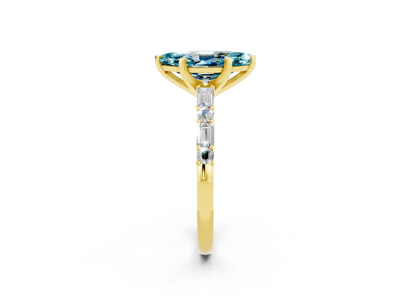 Yellow gold Marquise Cut Blue Topaz Solitaire with Side Baguettes and Channel Set Band