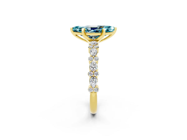 Yellow gold Marquise Cut Blue Topaz Side Stone Solitaire Ring with Round  and Four-Prong Setting