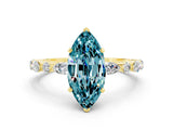 Yellow gold Marquise Cut Blue Topaz Solitaire with Side Stones on a Pavé Band and Four-Prong Setting