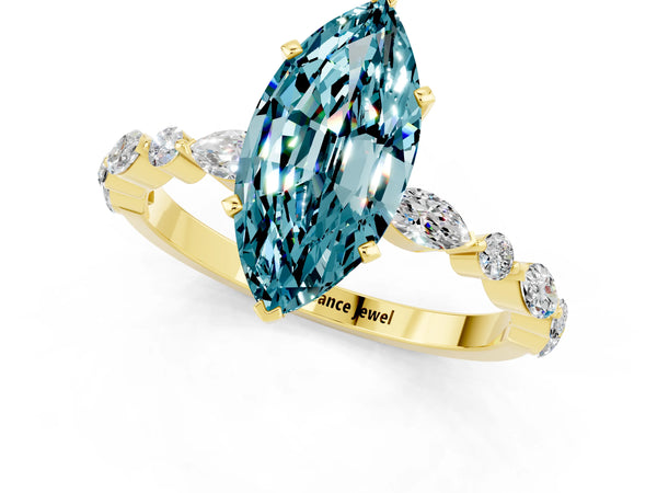 Yellow gold Marquise Cut Blue Topaz Ring with Marquise and Round  Side Stones and Four-Prong Setting