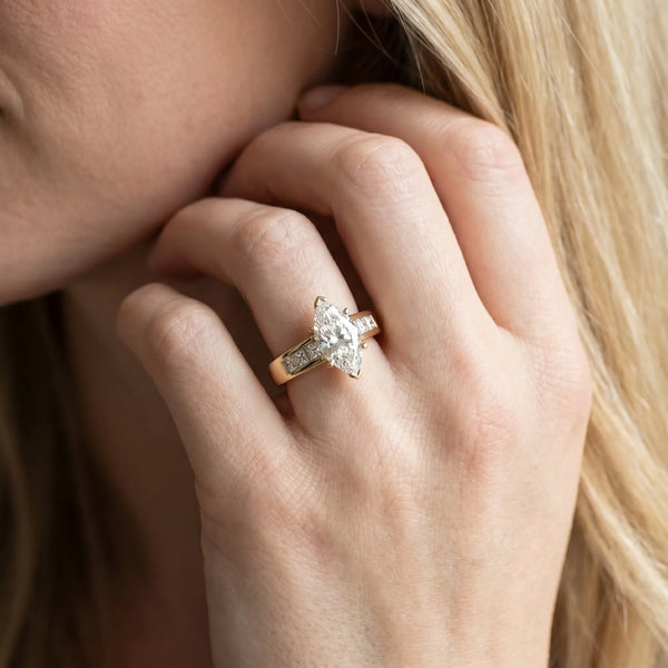Yellow gold Marquise Cut Channel Set Solitaire Ring with Four-Prong Setting