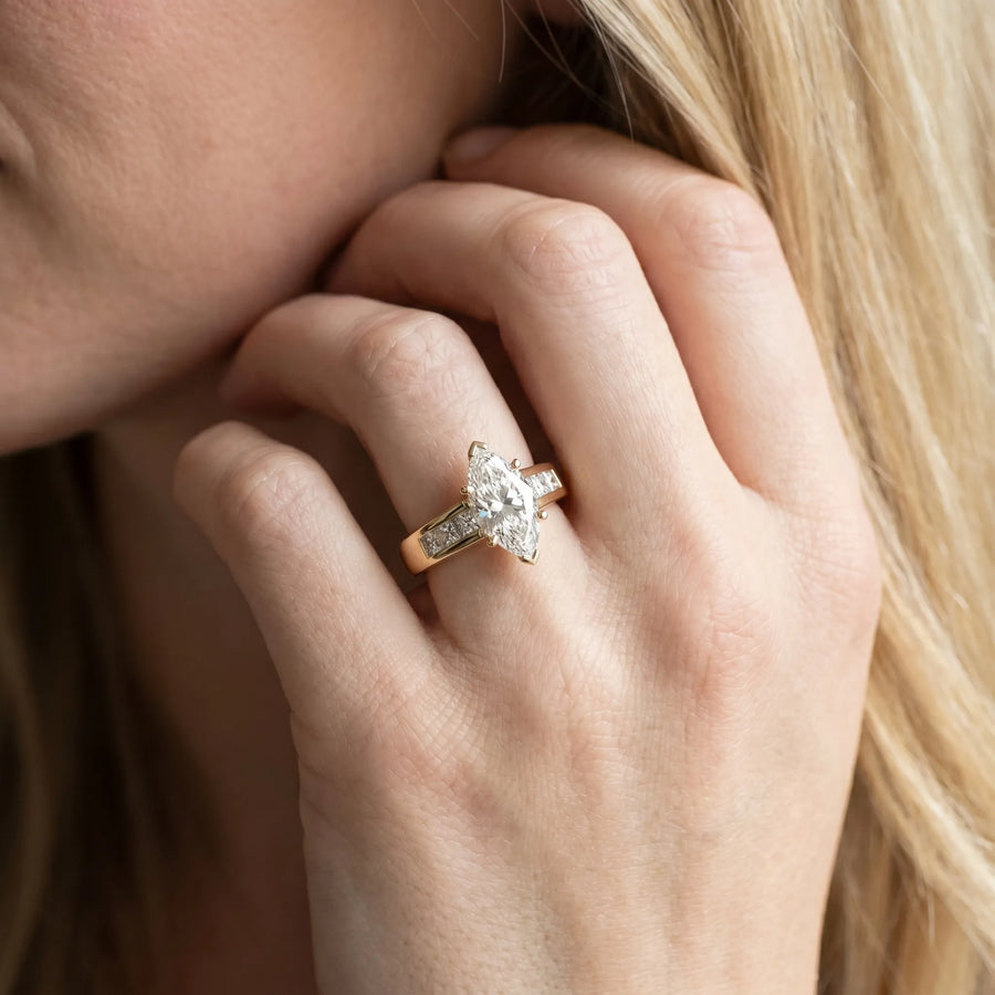 Yellow gold Marquise Cut Channel Set Solitaire Ring with Four-Prong Setting