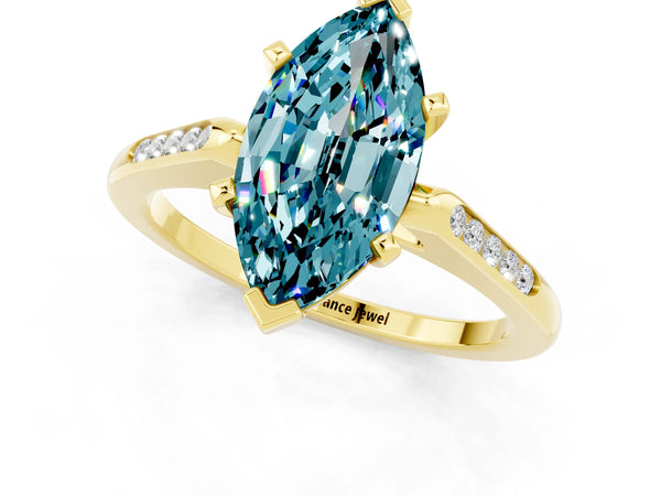 Yellow gold Marquise Cut Blue Topaz Solitaire Ring with Channel Set Round Band and Prong Setting