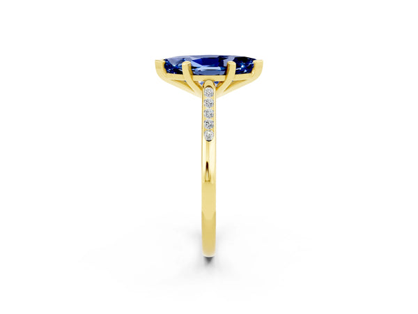 Yellow gold Marquise Cut Blue Sapphire Solitaire Ring with Channel Set Round Band and Prong Setting