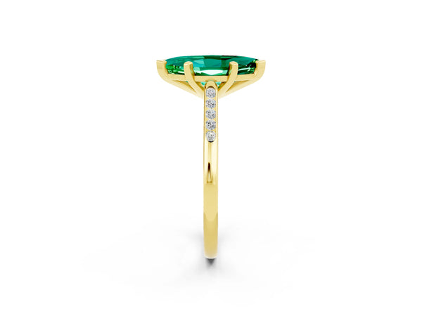 Yellow gold Marquise Cut Emerald Solitaire Ring with Channel Set Round Band and Prong Setting
