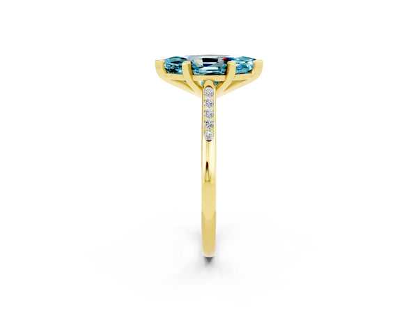 Yellow gold Marquise Cut Blue Topaz Solitaire Ring with Channel Set Round Band and Prong Setting