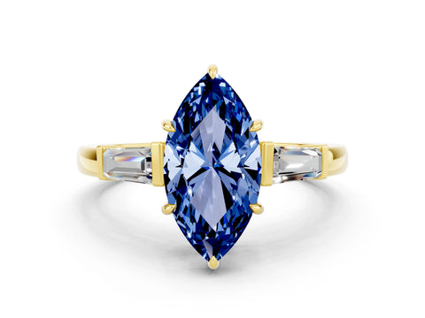 Yellow gold Marquise Cut Cut Diamond Ring with Tapered Baguette Side Stones in Four-Prong Setting