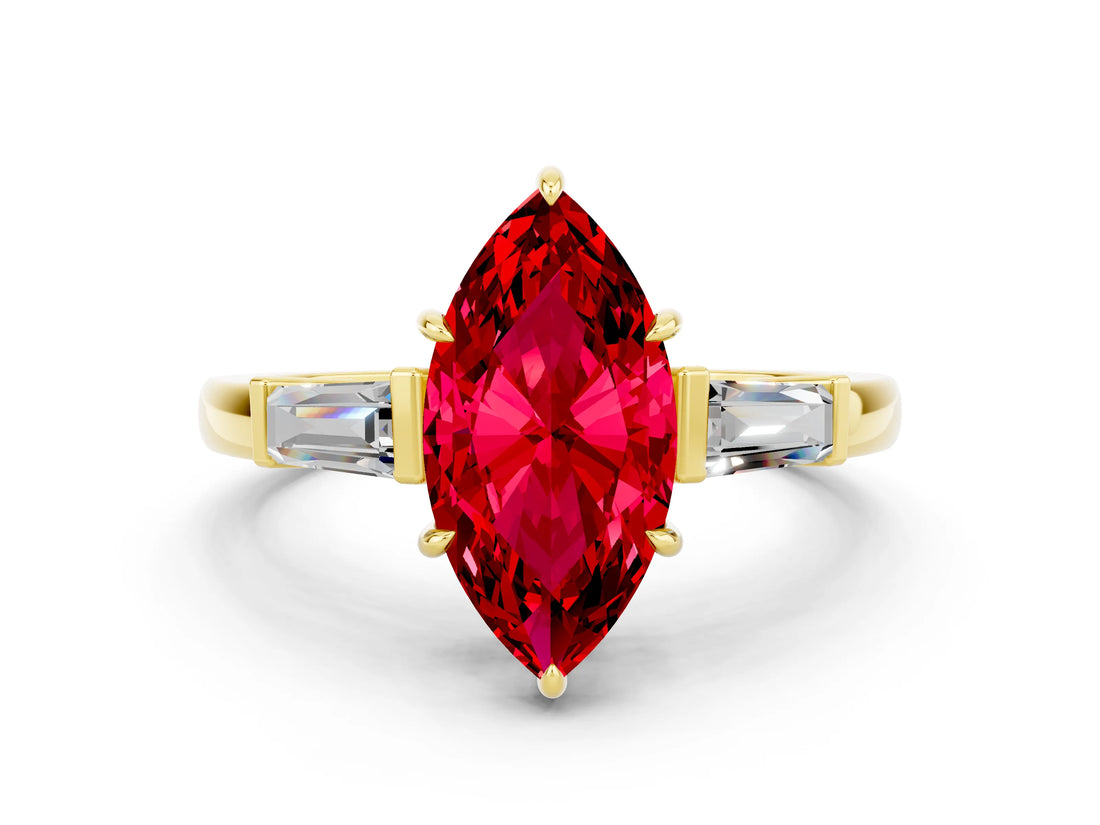 Yellow gold Marquise Cut Cut Diamond Ring with Tapered Baguette Side Stones in Four-Prong Setting