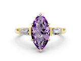 Yellow gold Marquise Cut Cut Diamond Ring with Tapered Baguette Side Stones in Four-Prong Setting