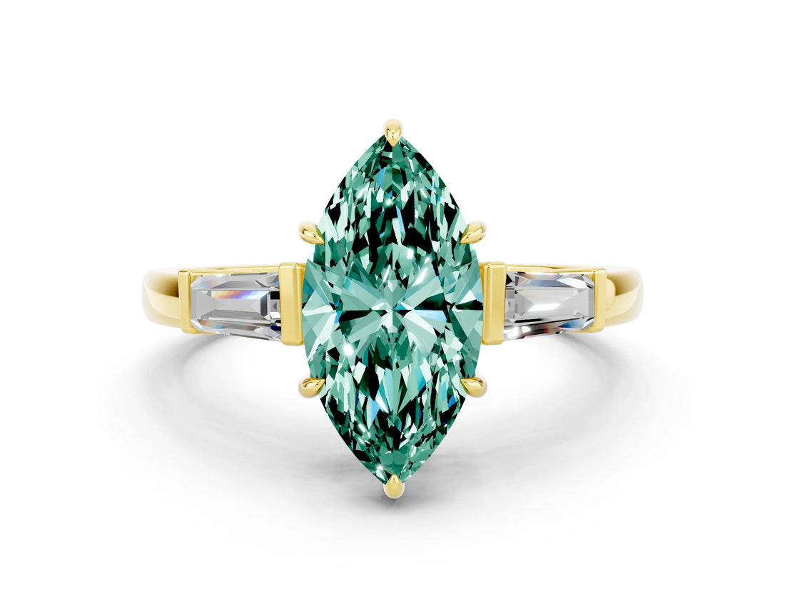 Yellow gold Marquise Cut Cut Diamond Ring with Tapered Baguette Side Stones in Four-Prong Setting