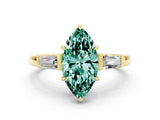 Yellow gold Marquise Cut Cut Diamond Ring with Tapered Baguette Side Stones in Four-Prong Setting