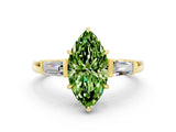 Yellow gold Marquise Cut Cut Diamond Ring with Tapered Baguette Side Stones in Four-Prong Setting