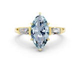 Yellow gold Marquise Cut Cut Diamond Ring with Tapered Baguette Side Stones in Four-Prong Setting