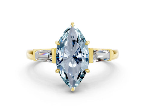 Yellow gold Marquise Cut Cut Diamond Ring with Tapered Baguette Side Stones in Four-Prong Setting