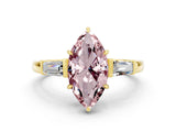 Yellow gold Marquise Cut Cut Diamond Ring with Tapered Baguette Side Stones in Four-Prong Setting