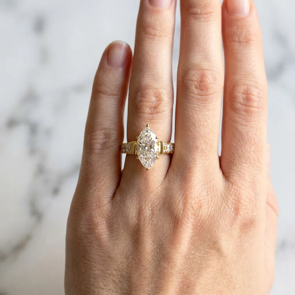 Yellow gold Marquise Cut Diamond Classic Solitaire Ring with Pavé Band and Four-Prong Setting