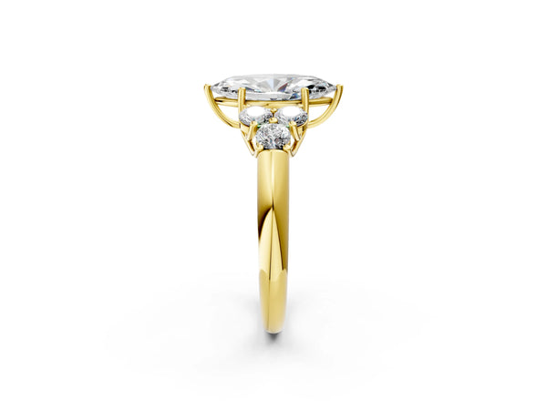 Yellow gold Marquise Cut Diamond Cluster Ring with Round Accent Stones and Prong Setting on a Classic Band