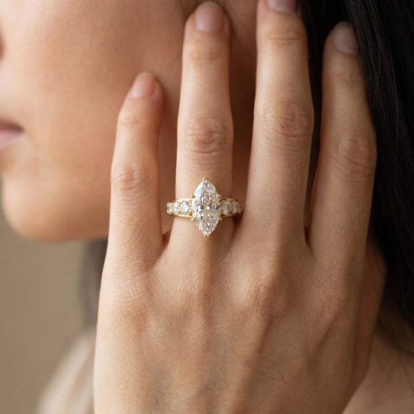 Yellow gold Marquise Cut Diamond Engagement Ring with Pavé Band and Four-Prong Setting
