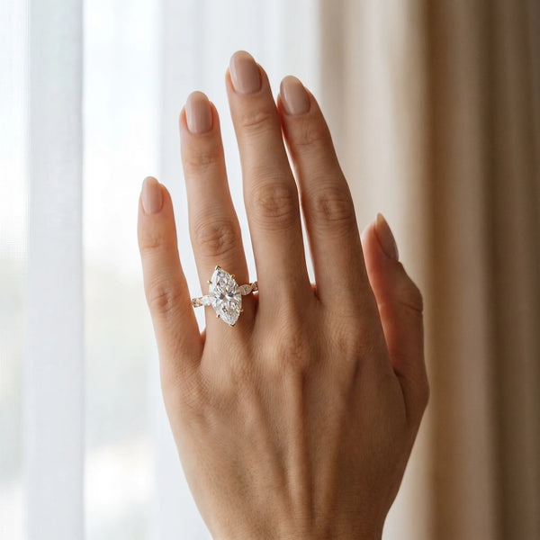 Yellow gold Marquise Cut Diamond Ring with Marquise Side Stones and Prong Setting