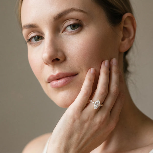 Yellow gold Marquise Cut Diamond Ring with Marquise Side Stones and Prong Setting