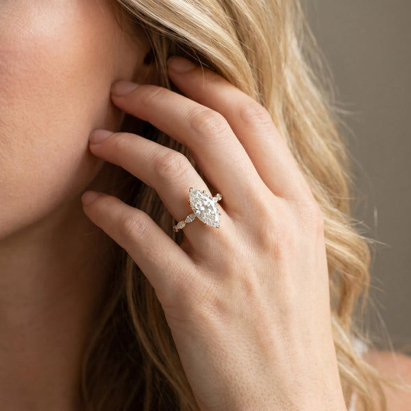 Yellow gold Marquise Cut Diamond Ring with Marquise Side Stones and Prong Setting