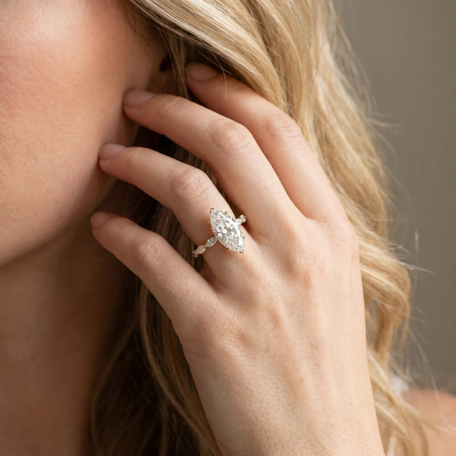 Yellow gold Marquise Cut Diamond Ring with Marquise Side Stones and Prong Setting