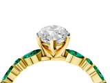 Yellow gold Marquise Cut Diamond Ring with Marquise and Round with Emerald side stone Side Stones and Four-Prong Setting_64