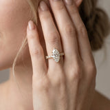 Yellow gold Marquise Cut Diamond Side Stone Solitaire Ring with Round  and Four-Prong Setting