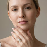 Yellow gold Marquise Cut Diamond Side Stone Solitaire Ring with Round  and Four-Prong Setting