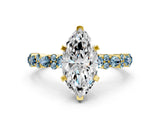 Yellow gold Marquise Cut Diamond Side Stone Solitaire Ring with Round with Aquamarine side stone and Four-Prong Setting