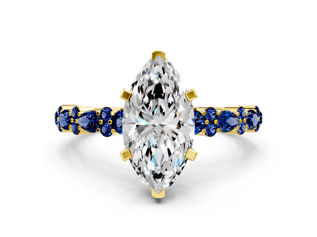 Yellow gold Marquise Cut Diamond Side Stone Solitaire Ring with Round with Blue Sapphire side stone and Four-Prong Setting