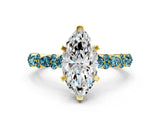 Yellow gold Marquise Cut Diamond Side Stone Solitaire Ring with Round with Blue Topaz side stone and Four-Prong Setting