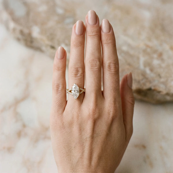 Yellow gold Marquise Cut Diamond Solitaire Ring with Four-Prong Setting and Twisted Pavé Band