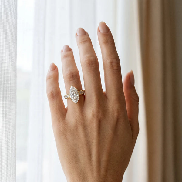 Yellow gold Marquise Cut Diamond Solitaire Ring with Micro Pave Band and Prong Setting