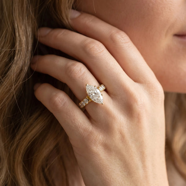 Yellow gold Marquise Cut Diamond Solitaire Ring with Micro Pave Band and Prong Setting