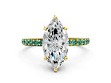 Yellow gold Marquise Cut Diamond Solitaire Ring with Round with Green Sapphire side stone Pavé Band and Prong Setting