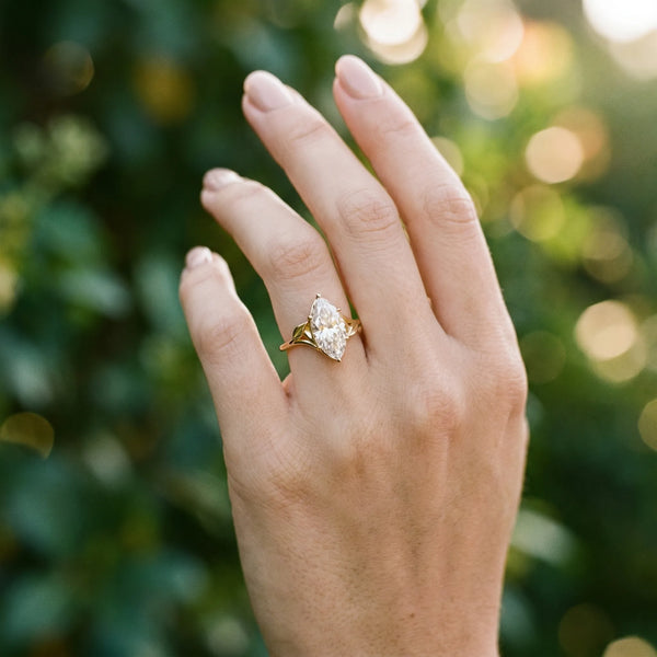 Yellow gold Marquise Cut Diamond Solitaire Ring with Twist Band and Four-Prong Setting